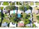 An aerial view of a neighborhood showing the houses, trees and swimming pools on the properties at 1540 Lime St, Clearwater, FL 33756