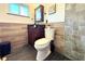 Bathroom showcasing elegant vanity, modern fixtures, tiled walls, and stylish design elements at 1540 Lime St, Clearwater, FL 33756