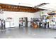 Spacious garage with ample storage, washer, dryer, and stainless steel refrigerator at 1540 Lime St, Clearwater, FL 33756