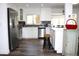 Bright kitchen with stainless steel appliances, white cabinets and breakfast bar at 1540 Lime St, Clearwater, FL 33756
