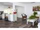 Open concept living room featuring updated flooring, neutral paint, and lots of natural light at 1540 Lime St, Clearwater, FL 33756