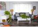 Bright, well lit living room with modern flooring, neutral paint, and curated furnishings at 1540 Lime St, Clearwater, FL 33756