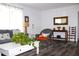 Bright, well lit living room with modern flooring, neutral paint, and curated furnishings at 1540 Lime St, Clearwater, FL 33756