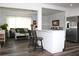 Bright and spacious living room featuring modern furnishings, stainless steel refrigerator, and open layout at 1540 Lime St, Clearwater, FL 33756