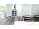 Open room featuring stylish floors, a dining table, and a unique display cabinet at 1540 Lime St, Clearwater, FL 33756