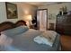 Bedroom with a bed, dresser, and nautical decor at 18255 Lake Lindsey Rd, Brooksville, FL 34601