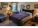 Bedroom featuring a bed, desk, and window with natural light at 18255 Lake Lindsey Rd, Brooksville, FL 34601