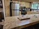 Well-equipped kitchen with modern appliances, plenty of counter space, and natural light from the window at 18255 Lake Lindsey Rd, Brooksville, FL 34601