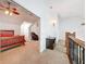 Hallway view of bedroom with ceiling fan and Primary suite with massage chair at 18308 Valor Path, Brooksville, FL 34604