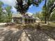 Traditional home exterior with inviting front porch and well-maintained landscaping at 18308 Valor Path, Brooksville, FL 34604
