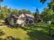 Sprawling single-Gathering home with screened in porch and ample backyard space surrounded by mature trees at 18308 Valor Path, Brooksville, FL 34604