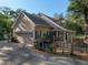 Two-story home with an attached garage, well-maintained landscaping, and a charming gated entrance at 18308 Valor Path, Brooksville, FL 34604