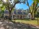 Exterior shot of the home with a long front porch at 18308 Valor Path, Brooksville, FL 34604