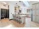 Elegant kitchen with granite countertops, an island with seating, and stainless steel appliances at 18308 Valor Path, Brooksville, FL 34604