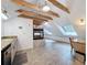 Bonus room featuring a fireplace, skylights, with tile floor and bar seating at 18308 Valor Path, Brooksville, FL 34604