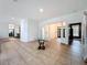 Spacious living room with tile floors, white walls, and stylish accents, creating a modern feel at 18308 Valor Path, Brooksville, FL 34604