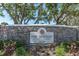Stone sign with the name of the community 'The Bentley at Cobb's Landing' address 3320 at 3260 Haviland Ct # 201, Palm Harbor, FL 34684