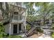 Charming condo building featuring private entries, black staircases, a beautiful landscaped courtyard and ample parking at 3260 Haviland Ct # 201, Palm Harbor, FL 34684