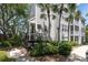 Attractive condo exterior with palm trees and manicured landscaping, walkable to a community at 3260 Haviland Ct # 201, Palm Harbor, FL 34684