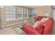 Comfortable living room showcasing hardwood floors, bright seating, and plenty of natural light at 3260 Haviland Ct # 201, Palm Harbor, FL 34684