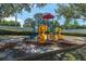 Community playground area features colorful slides, stairs, and climbing structures at 3260 Haviland Ct # 201, Palm Harbor, FL 34684