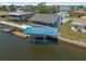 Waterfront home featuring a private boat dock and spacious screened in porch, perfect for enjoying serene water views at 3362 Minnow Creek Dr, Hernando Beach, FL 34607
