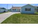 Inviting single-story home with well-maintained lawn and a concrete driveway leading to the front entrance at 3362 Minnow Creek Dr, Hernando Beach, FL 34607