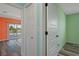Hallway with clean, modern doors leads to the waterfront living area and rooms with colorful accents at 3362 Minnow Creek Dr, Hernando Beach, FL 34607