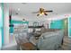 Open-concept living space seamlessly connecting the living room, dining area, and modern kitchen at 3362 Minnow Creek Dr, Hernando Beach, FL 34607
