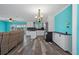Bright, open-concept space with modern kitchen, stylish flooring, and easy access to outdoor areas at 3362 Minnow Creek Dr, Hernando Beach, FL 34607