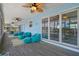 This is an amazing screened porch overlooking the water, featuring blue beanbag chairs, a rug, and access to the waterfront at 3362 Minnow Creek Dr, Hernando Beach, FL 34607