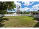 Large backyard with a well-maintained lawn and privacy fence, perfect for outdoor activities and relaxation at 37623 Florida Ave, Dade City, FL 33525
