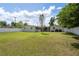 Spacious backyard with a well-kept lawn, featuring a privacy fence and an inviting outdoor space at 37623 Florida Ave, Dade City, FL 33525