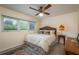 Bedroom showcasing a comfy queen bed, natural lighting, and neutral tones at 37623 Florida Ave, Dade City, FL 33525
