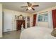 Cozy bedroom with unique bedframe, an adjacent bathroom, and a large dresser at 37623 Florida Ave, Dade City, FL 33525