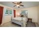Charming bedroom featuring a uniquely designed bed frame, soft lighting, and neutral decor at 37623 Florida Ave, Dade City, FL 33525