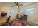 Comfortable office area featuring a desk and bright natural light from the large windows at 37623 Florida Ave, Dade City, FL 33525