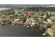 Neighborhood aerial view showcasing the home's waterfront location and nearby amenities at 417 Inness Dr, Tarpon Springs, FL 34689