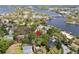 Home in a residential neighborhood near a river, highlighted by a red location pin at 417 Inness Dr, Tarpon Springs, FL 34689