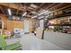 Spacious unfinished basement offering ample storage or customizable space with shelving and open ceiling at 417 Inness Dr, Tarpon Springs, FL 34689