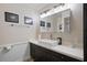 Updated bathroom featuring modern fixtures, stylish vanity, and a well-lit mirror at 417 Inness Dr, Tarpon Springs, FL 34689
