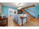 Dining room with hardwood floors, staircase, and chandelier open to other rooms at 417 Inness Dr, Tarpon Springs, FL 34689