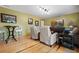 Comfortable living room with hardwood floors, neutral paint, and ample space for relaxation at 417 Inness Dr, Tarpon Springs, FL 34689