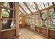 Interior view of the treehouse showing the framed windows and wood floor at 417 Inness Dr, Tarpon Springs, FL 34689