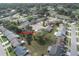 Aerial view of a neighborhood, highlighting the property's location among well-maintained homes and green spaces at 4647 Gazebo Ct, New Port Richey, FL 34655