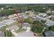 Aerial view of a charming home nestled in a peaceful community with mature trees and well-manicured lawns at 4647 Gazebo Ct, New Port Richey, FL 34655