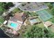 Overhead view of the community's pool, shuffleboard, tennis courts, parking and clubhouse and manicured lawns at 4647 Gazebo Ct, New Port Richey, FL 34655