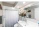 Bright bathroom features modern fixtures, a clean vanity, and coordinated decor at 4647 Gazebo Ct, New Port Richey, FL 34655