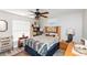 Cozy bedroom with a ceiling fan, neutral walls, and natural light from the windows at 4647 Gazebo Ct, New Port Richey, FL 34655