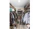 Well-organized walk-in closet with built-in shelving and ample storage space for clothes and accessories at 4647 Gazebo Ct, New Port Richey, FL 34655